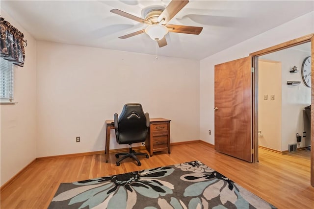 office with hardwood / wood-style flooring and ceiling fan