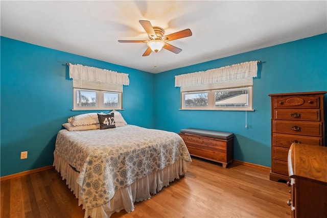 bedroom featuring hardwood / wood-style floors and ceiling fan