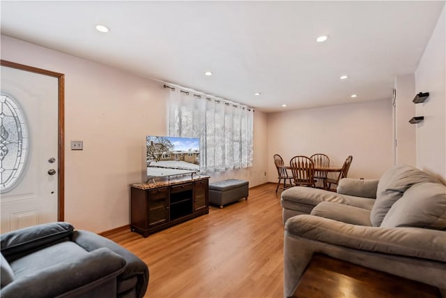 living room with light hardwood / wood-style flooring