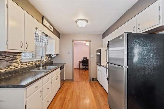 kitchen featuring white cabinets and appliances with stainless steel finishes