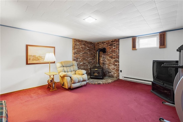 living area featuring a baseboard radiator, carpet, and a wood stove