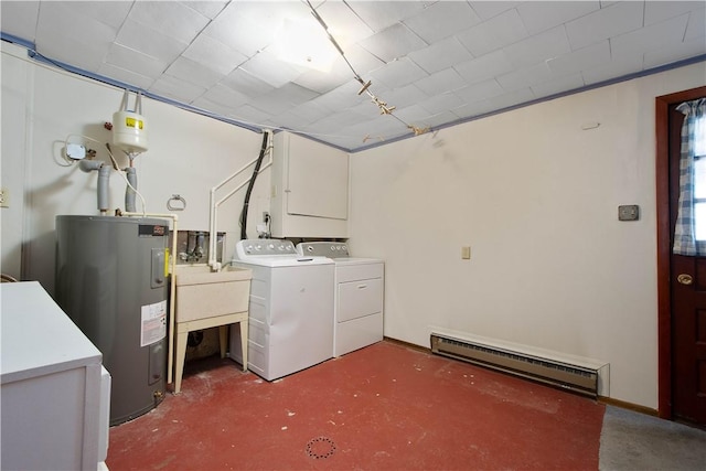 washroom featuring electric water heater, washing machine and dryer, and a baseboard heating unit