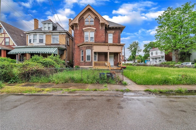 view of front of property featuring covered porch