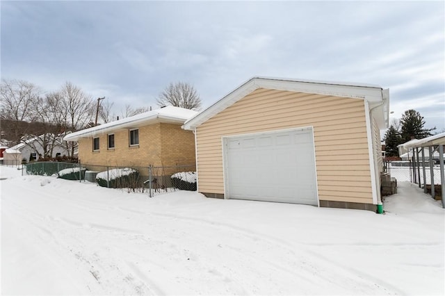 exterior space with an outbuilding and a garage