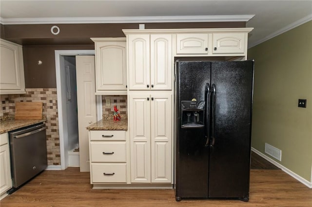 kitchen with dark wood-type flooring, black refrigerator with ice dispenser, dishwasher, and stone counters