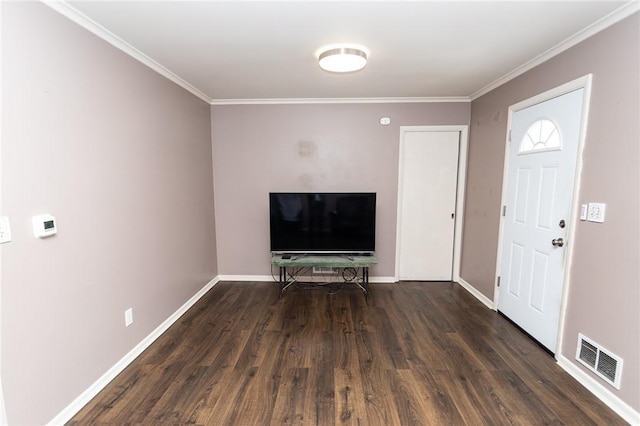 entrance foyer featuring crown molding and dark hardwood / wood-style flooring