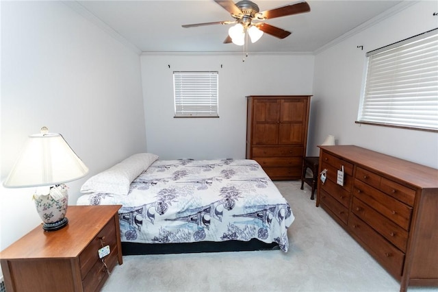 bedroom featuring ornamental molding, light carpet, and ceiling fan