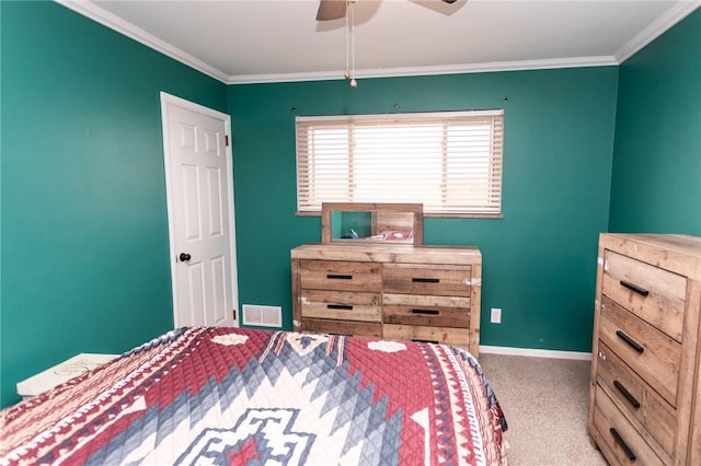 carpeted bedroom with crown molding and ceiling fan