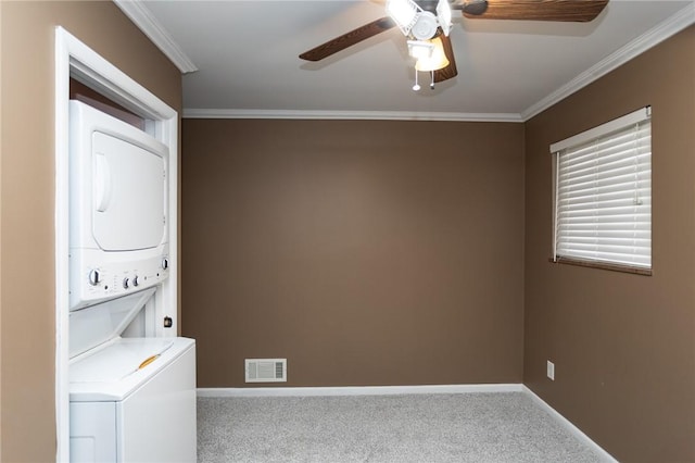 washroom with stacked washer / drying machine, crown molding, ceiling fan, and carpet flooring