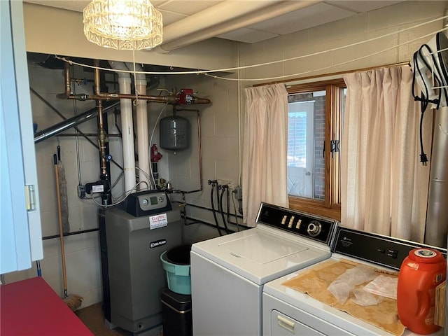 clothes washing area with washer and dryer