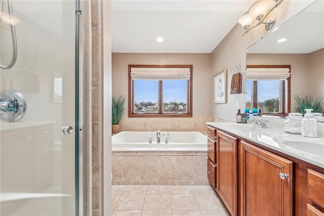 bathroom with vanity, tile patterned floors, and independent shower and bath