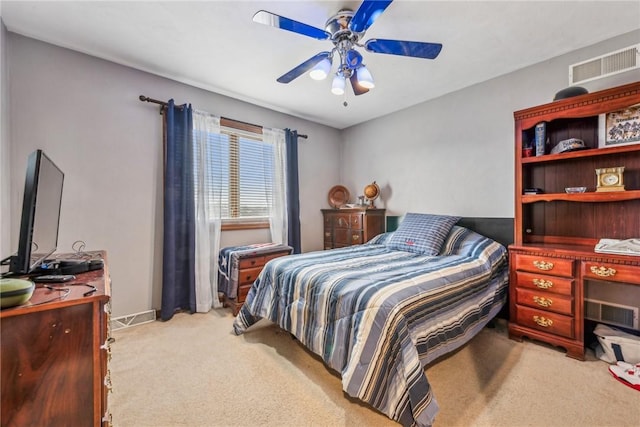 bedroom with light carpet and ceiling fan