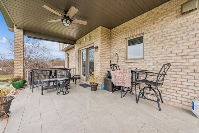 view of patio featuring ceiling fan