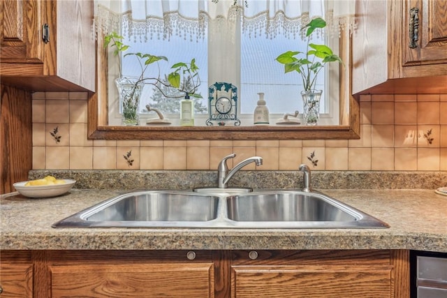 kitchen featuring sink and decorative backsplash