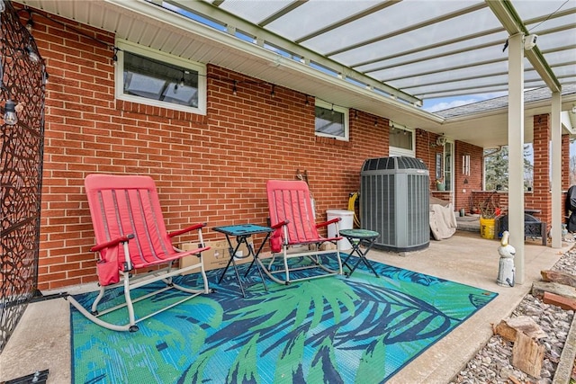 view of patio with central AC and a pergola