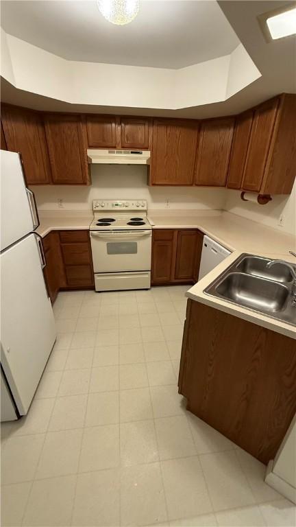 kitchen with sink and white appliances