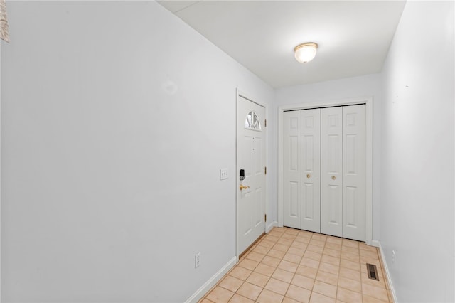 foyer with light tile patterned floors