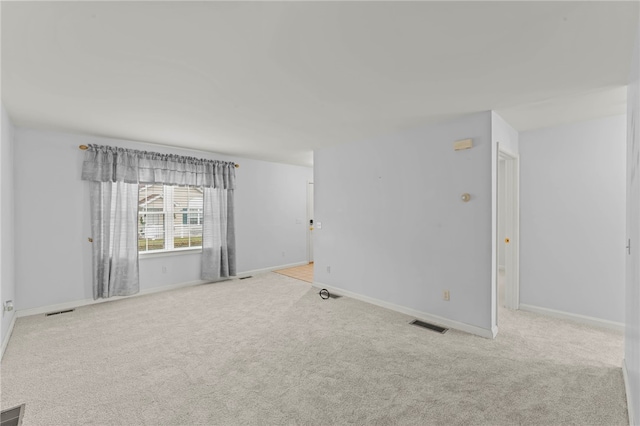 empty room with light colored carpet