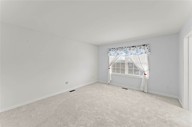 empty room featuring carpet floors