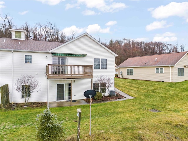 back of property featuring central AC, a lawn, and a deck