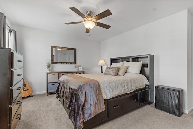 bedroom with ceiling fan and light colored carpet