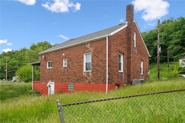 3260 Rainbow Run Rd, Forward Twp Eal, PA 15063 - view of property exterior with a chimney, brick siding, and central AC