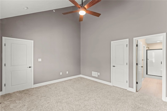 carpeted empty room with ceiling fan