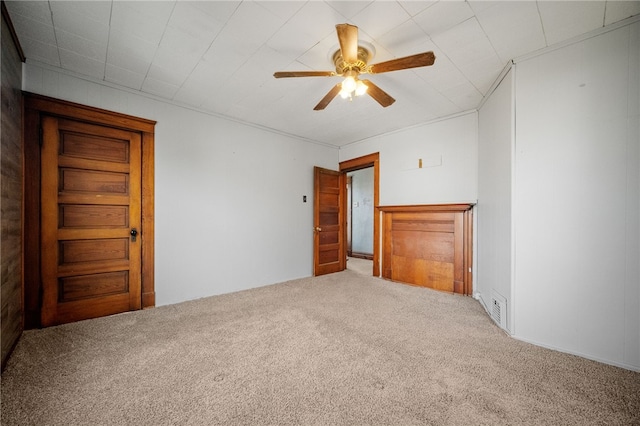 carpeted empty room with ceiling fan