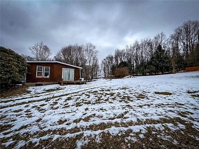 view of yard covered in snow