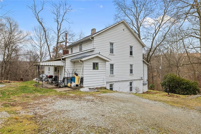 back of house featuring a patio area