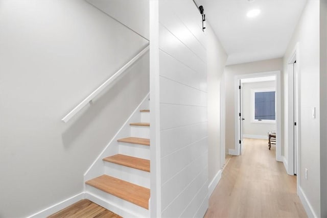 staircase featuring hardwood / wood-style floors