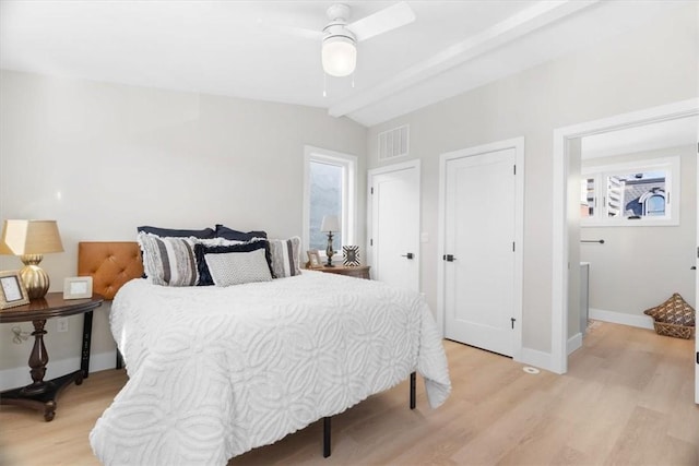 bedroom with lofted ceiling, light hardwood / wood-style flooring, and ceiling fan