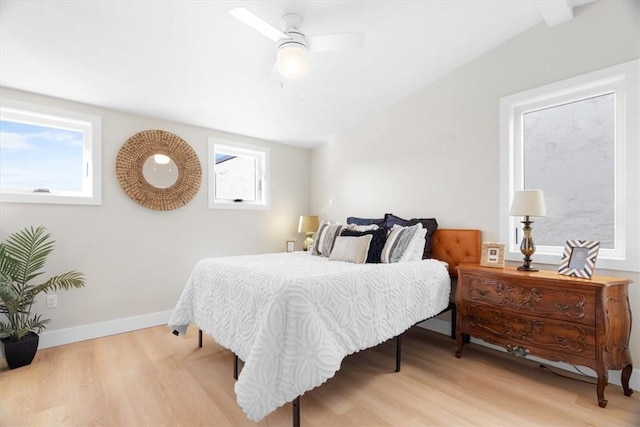 bedroom with light hardwood / wood-style floors and ceiling fan