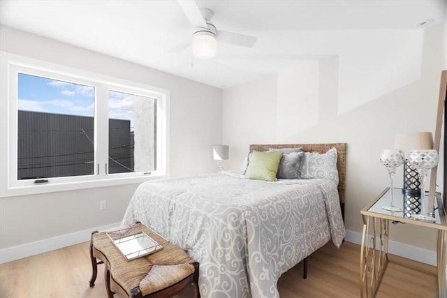 bedroom featuring ceiling fan and hardwood / wood-style floors