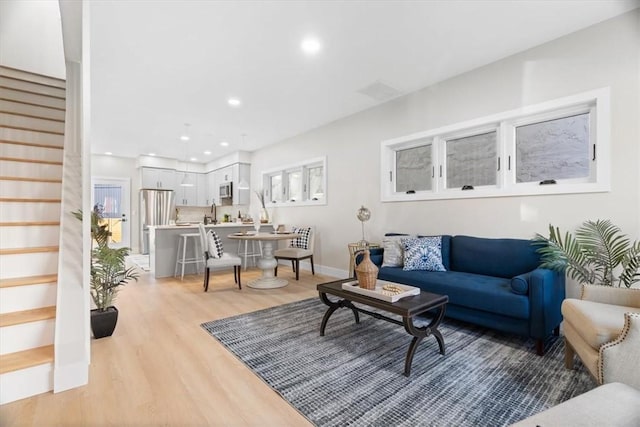 living room with light hardwood / wood-style flooring