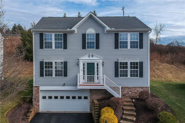 colonial inspired home featuring a garage