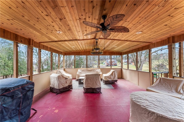 sunroom / solarium with wood ceiling and ceiling fan