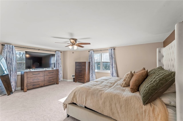 bedroom with light carpet and ceiling fan