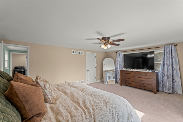 bedroom featuring ceiling fan and light carpet