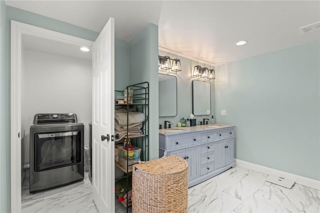 bathroom featuring washer / clothes dryer and vanity