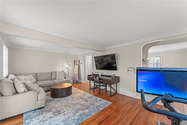 living room featuring hardwood / wood-style flooring and ornamental molding