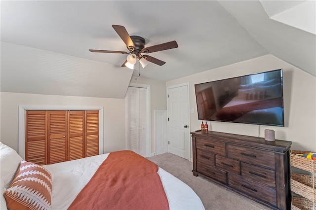 bedroom featuring ceiling fan, light colored carpet, and vaulted ceiling