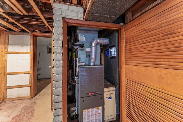 utility room with heating unit