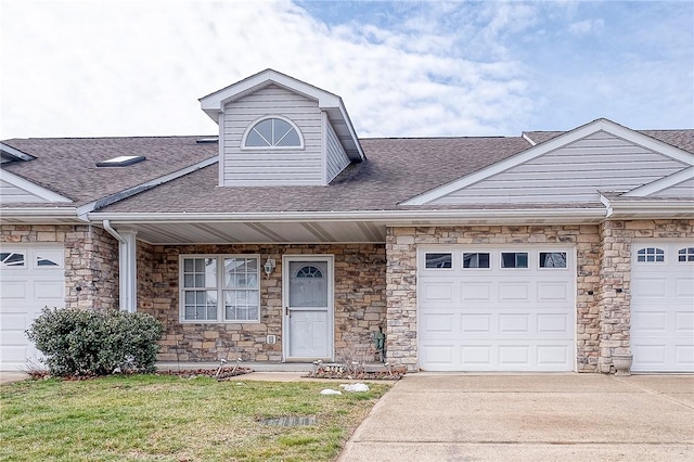 view of front facade with a garage and a front lawn