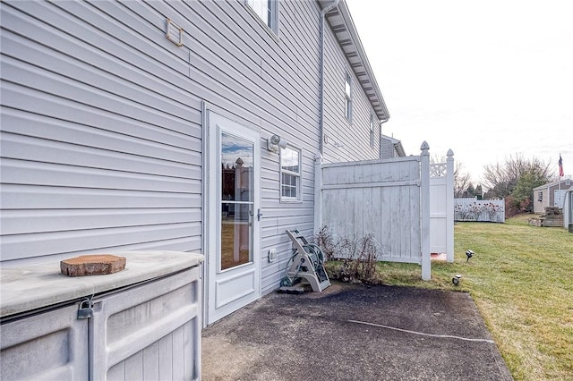 view of side of property with a yard