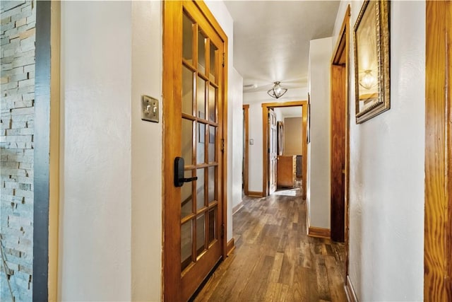 hallway with dark wood-type flooring