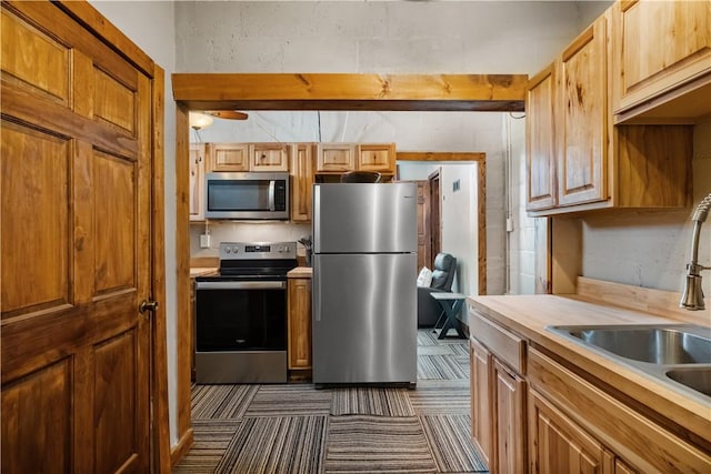 kitchen with sink and stainless steel appliances