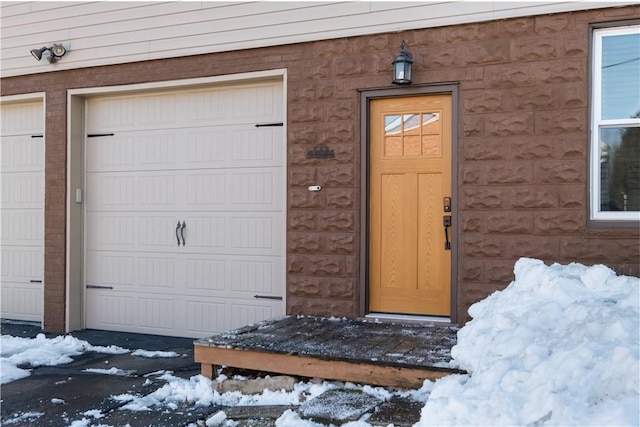 view of snow covered property entrance