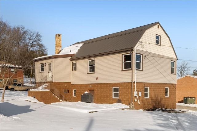 view of snow covered property