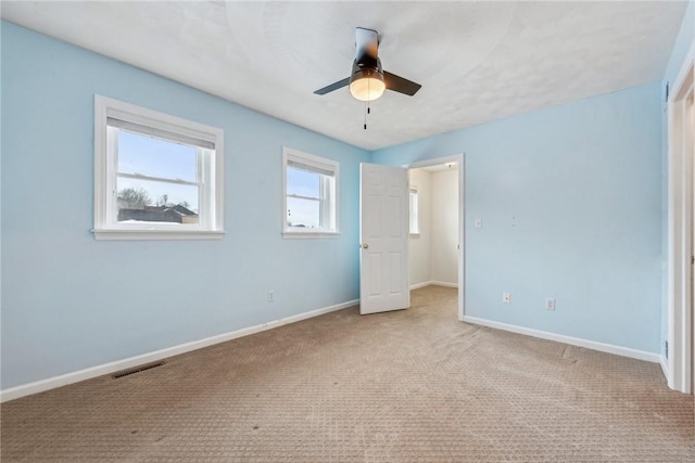 unfurnished bedroom with light carpet and ceiling fan